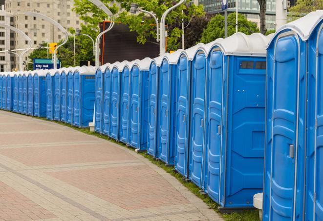 a row of portable restrooms at a fairground, offering visitors a clean and hassle-free experience in Hershey PA